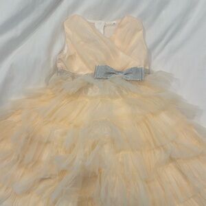 Brand new never worn formal cream tulle dress. Perfect for holidays!